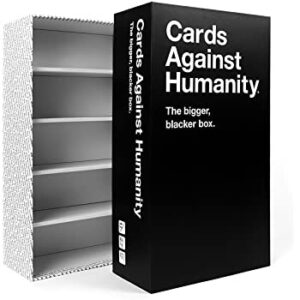 CARDS AGAINST HUMANITY THE BIGGER, BLACKER BOX. THE BIGGER BLACKER BOX IS AN EMPTY STORAGE CASE BIG ENOUGH TO HOLD ALL THE CARDS WE’VE EVER MADE, WITH ROOM FOR EVEN MORE GAMES